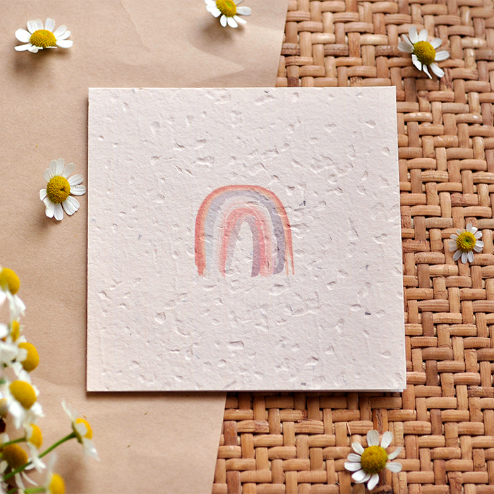 Eco-friendly Nurturing Nature Card with rainbow design and embedded swan river daisies, plantable and made from 100% recycled materials.