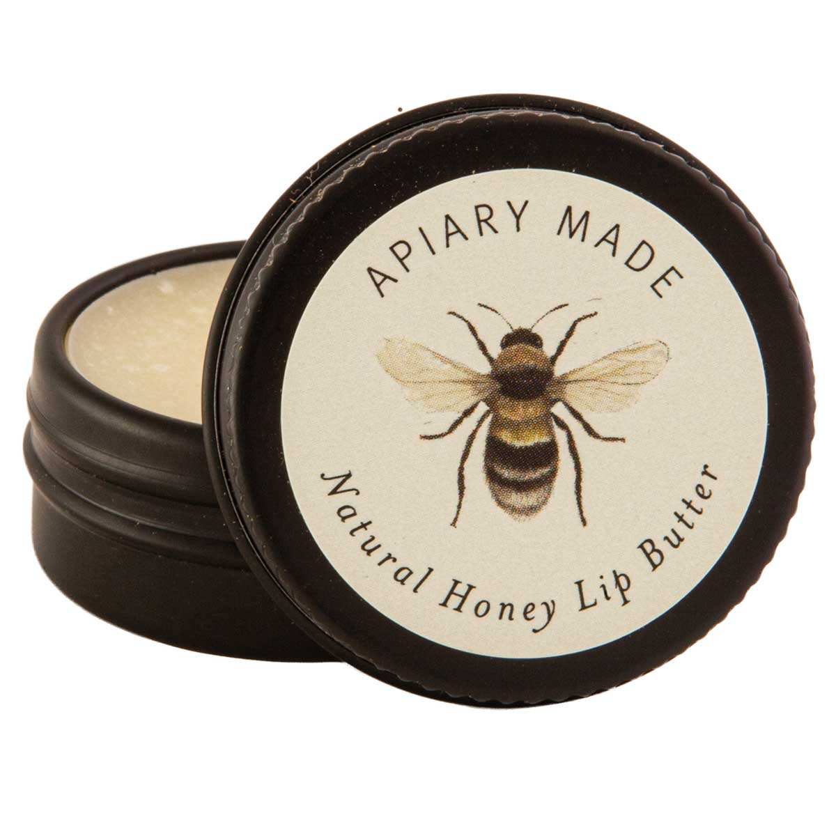 Apiary Made Natural Honey Lip Butter in a round container with a bee illustration on the lid.