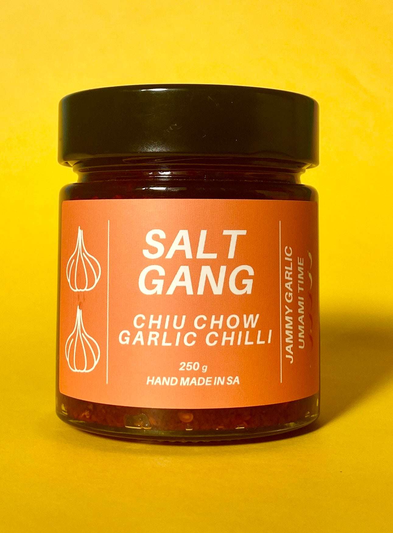 Salt Gang Chiu Chow Garlic Chilli jar on a yellow background.