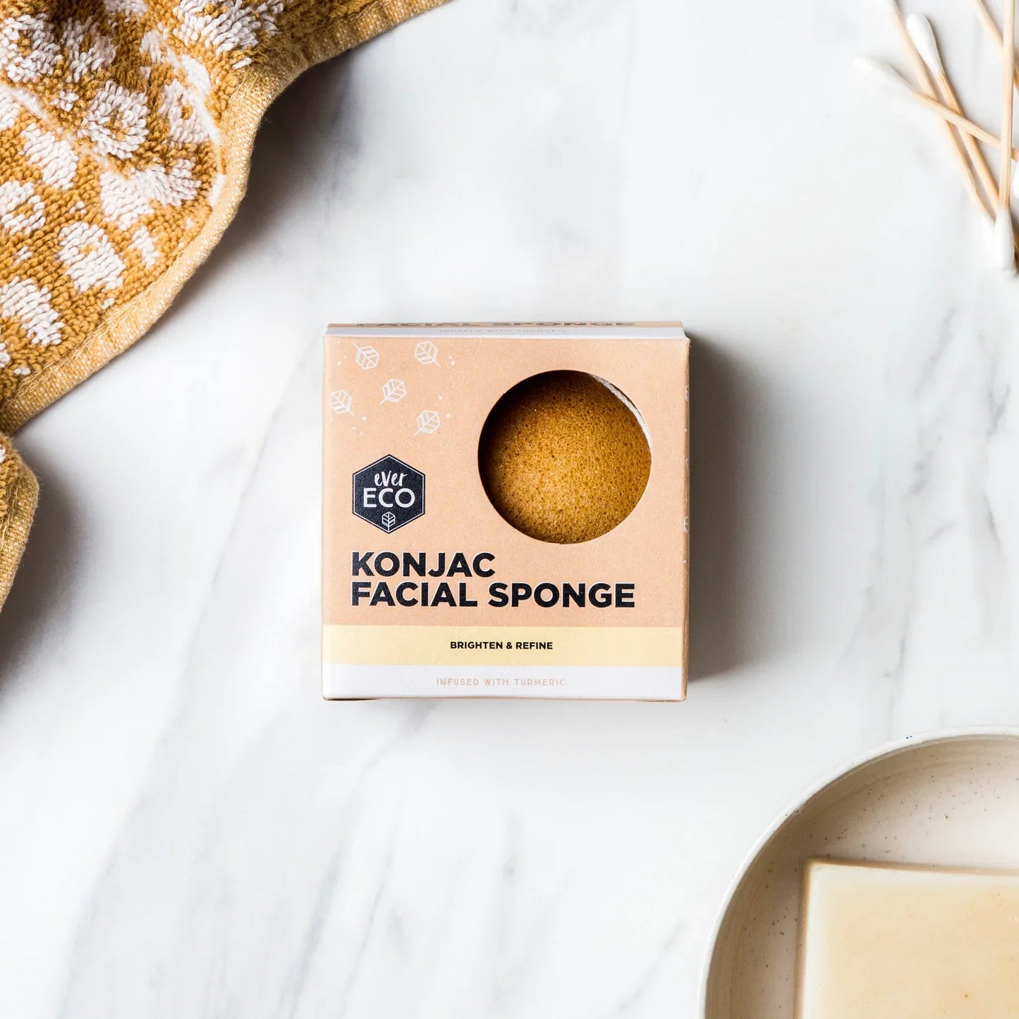 Ever Eco Konjac Facial Sponge on marble countertop, natural skincare product.