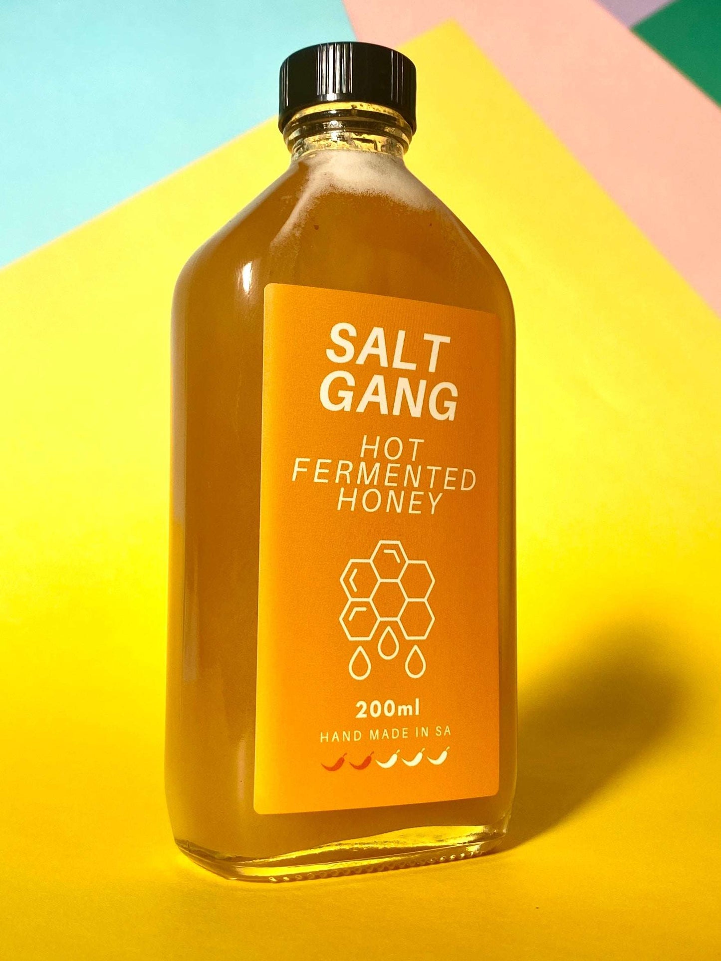 Salt Gang Hot Fermented Honey in 200ml glass jar with vibrant label, vegan and gluten-free.