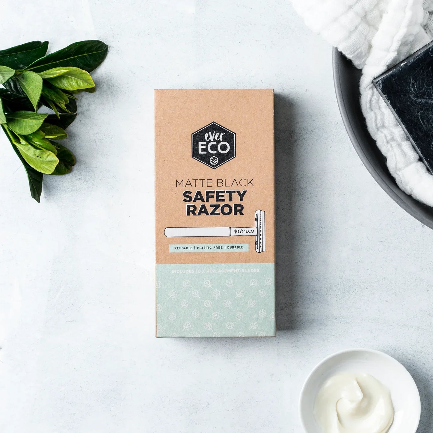 Eco-friendly safety razor with replacement blades, plastic-free packaging, matte black finish, Ever Eco brand.
