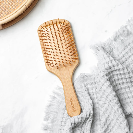 Eco-friendly bamboo hair brush with natural rubber, large paddle design.