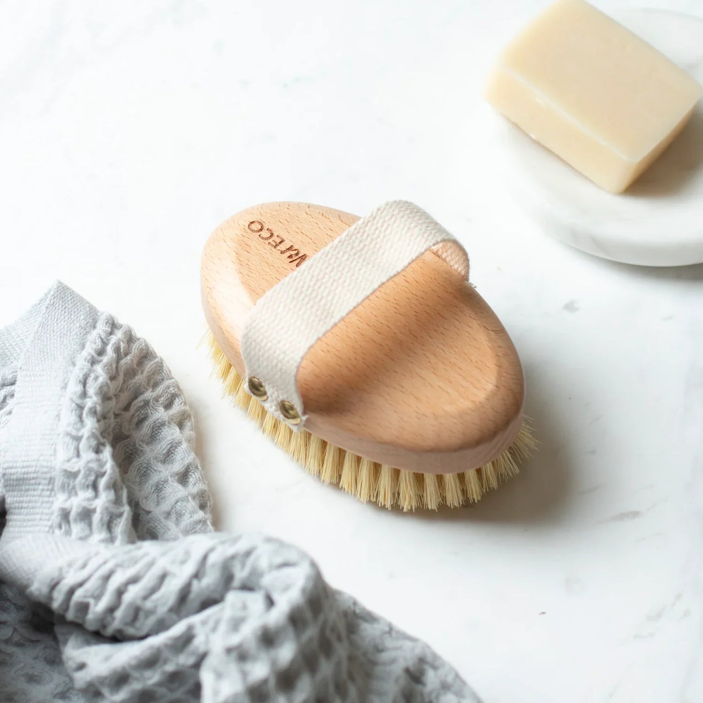 Eco-friendly dry body brush with beechwood handle and sisal bristles.