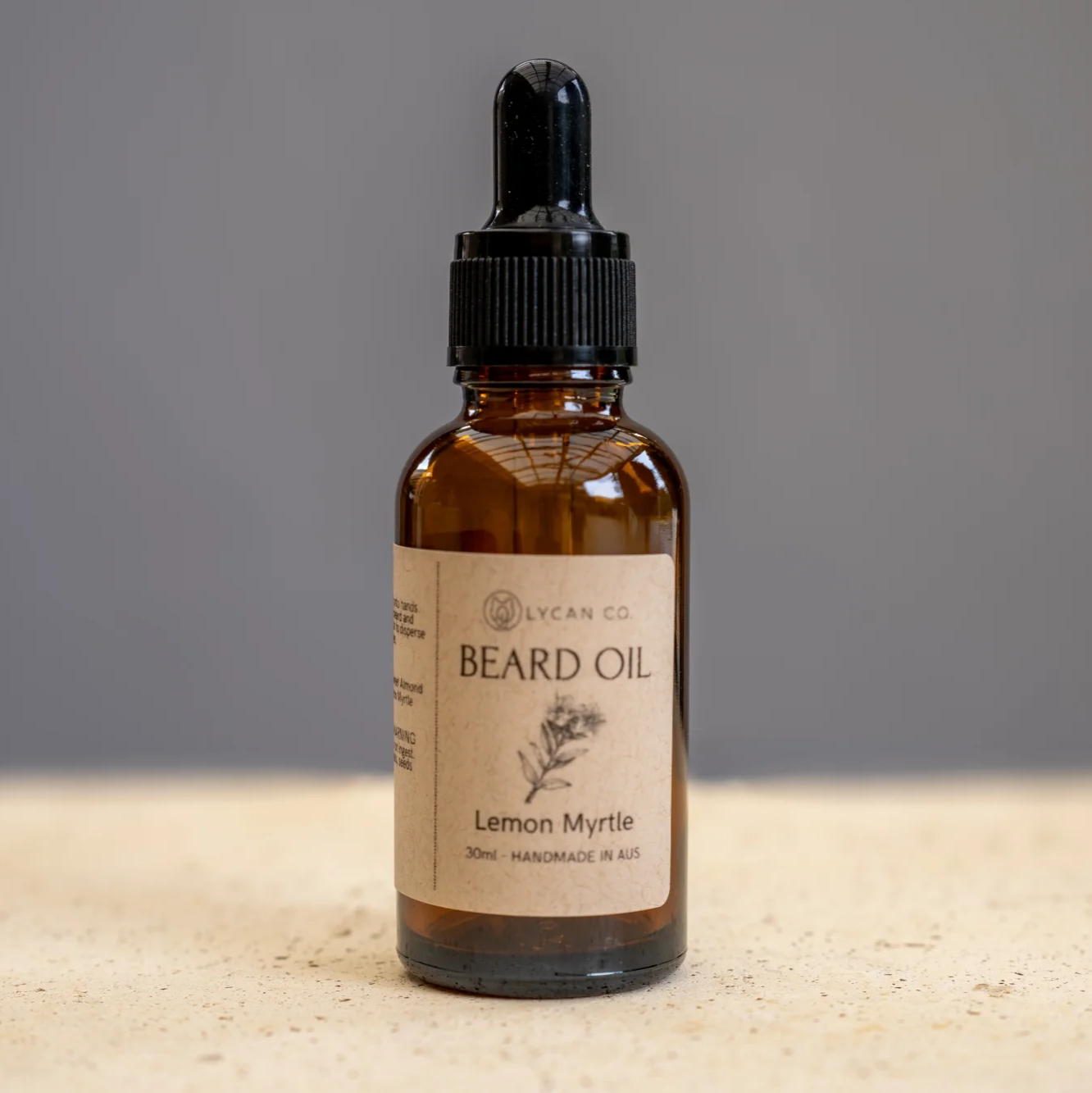Lycan Co Lemon Myrtle Beard Oil in amber glass bottle with dropper.