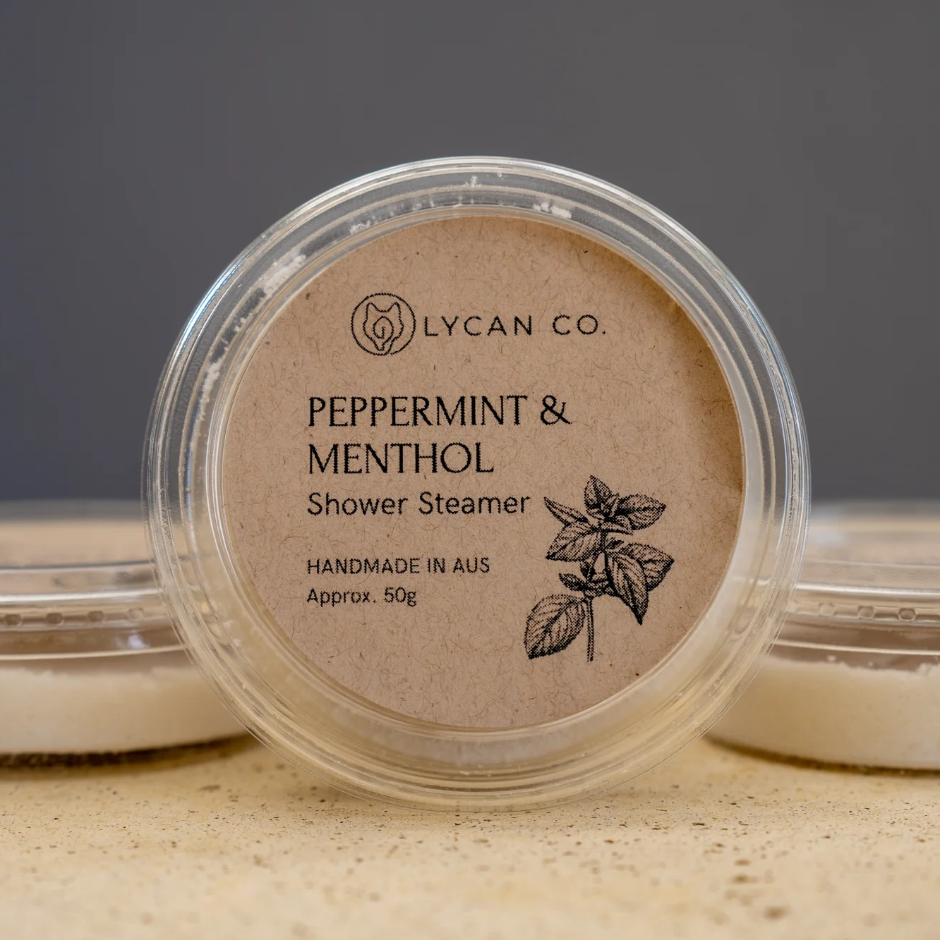 Lycan Co Peppermint and Menthol Shower Steamer in compostable packaging.