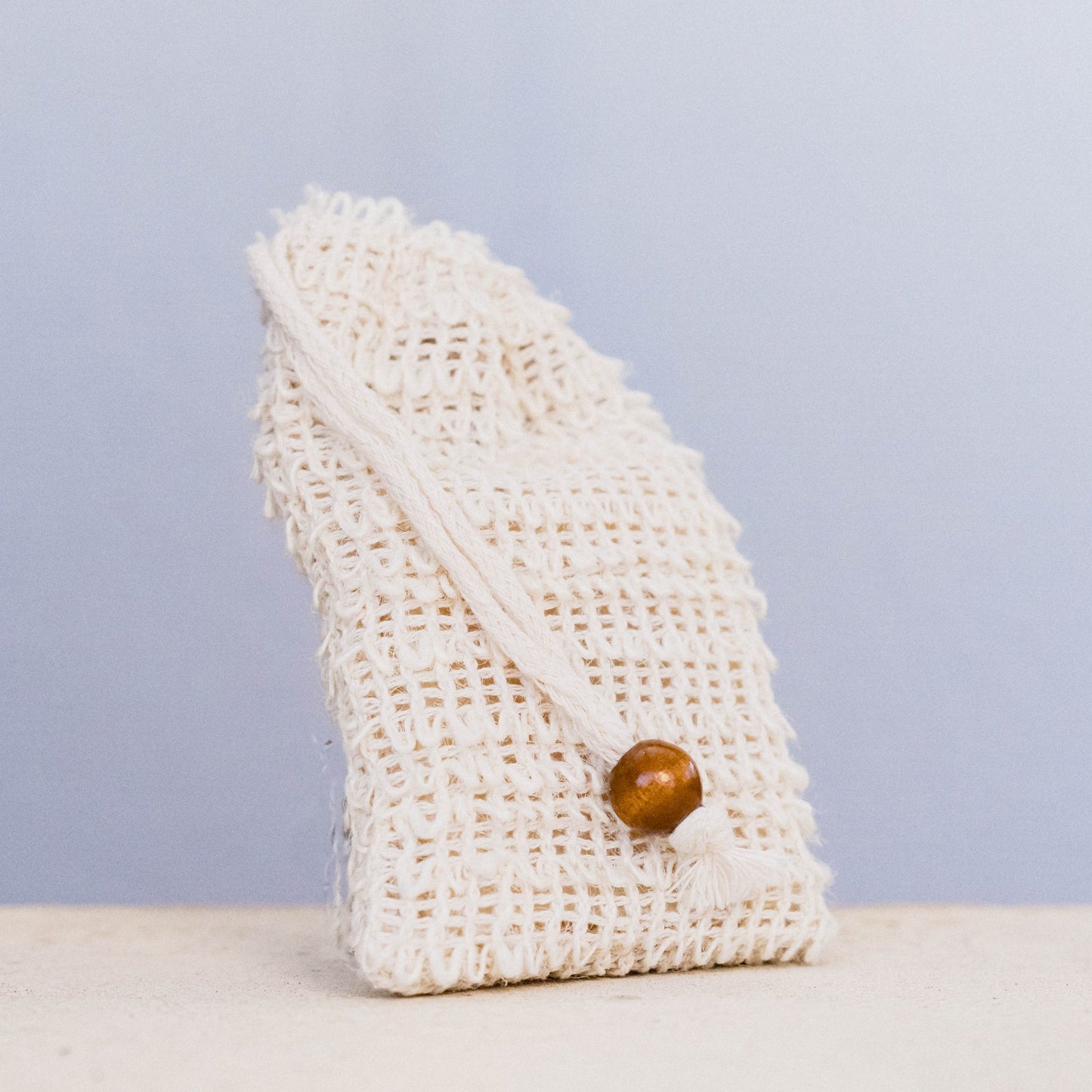 Hessian net bag for soap storage and exfoliation with stylish design.