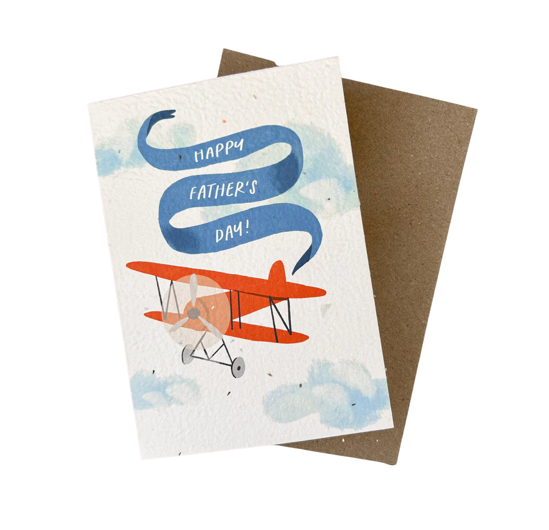 Happy Father's Day plantable card with red airplane illustration on seeded recycled paper and brown envelope