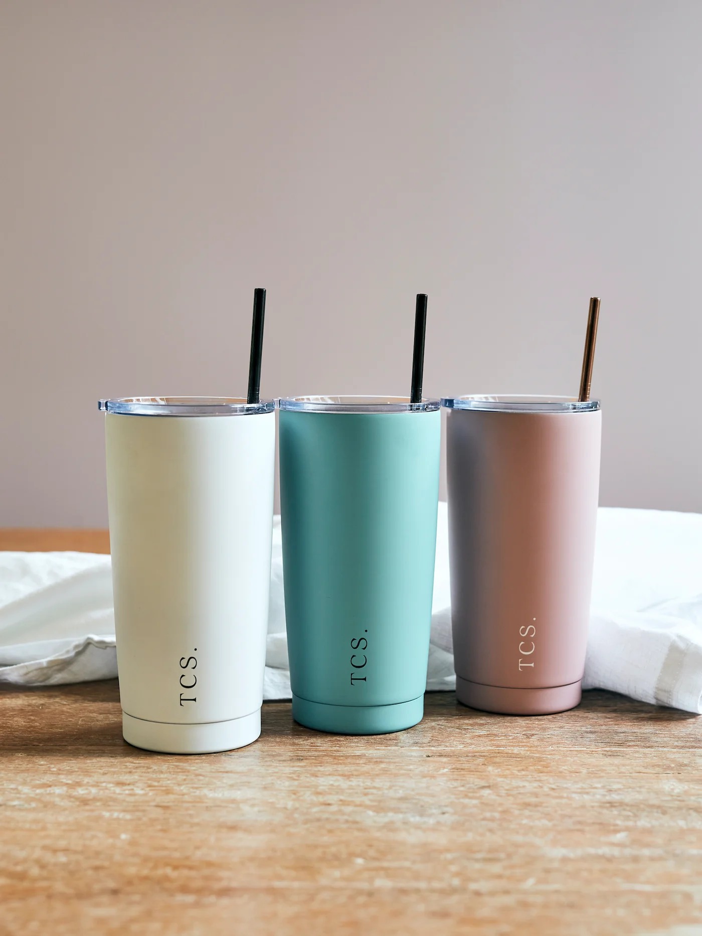 Conscious Store insulated smoothie cups with straws in white, blue, and dusk colors.