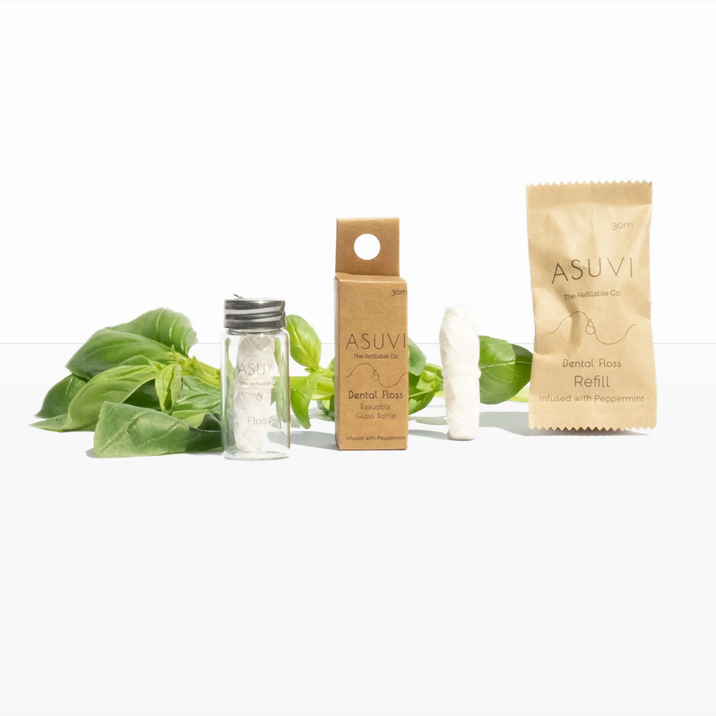 Eco-friendly Asuvi Dental Floss in reusable glass bottle with compostable refills, mint scent.
