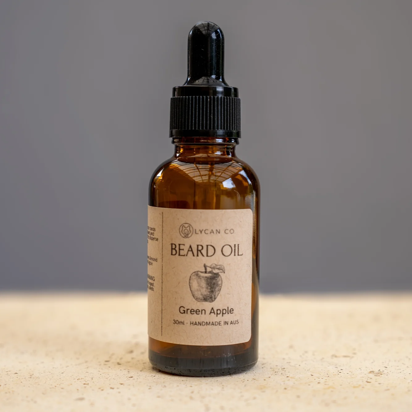 Green Apple Beard Oil bottle by Lycan Co on a neutral background.