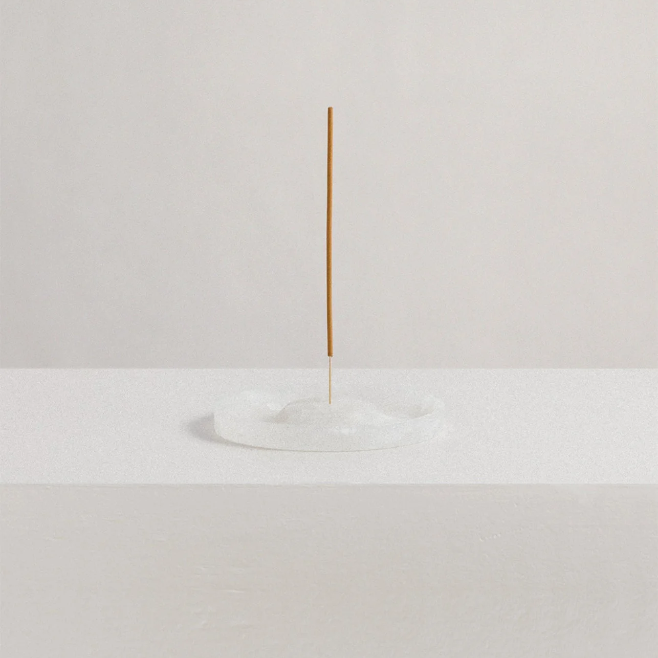Addition Studio - Dune Incense Burner - White OnyxCarved from solid stone, the Dune Incense Burner has simple minimal curves. As ifcarved by wind and time this mini landscape is designed to catch ash as it falls.DimAddition Studio