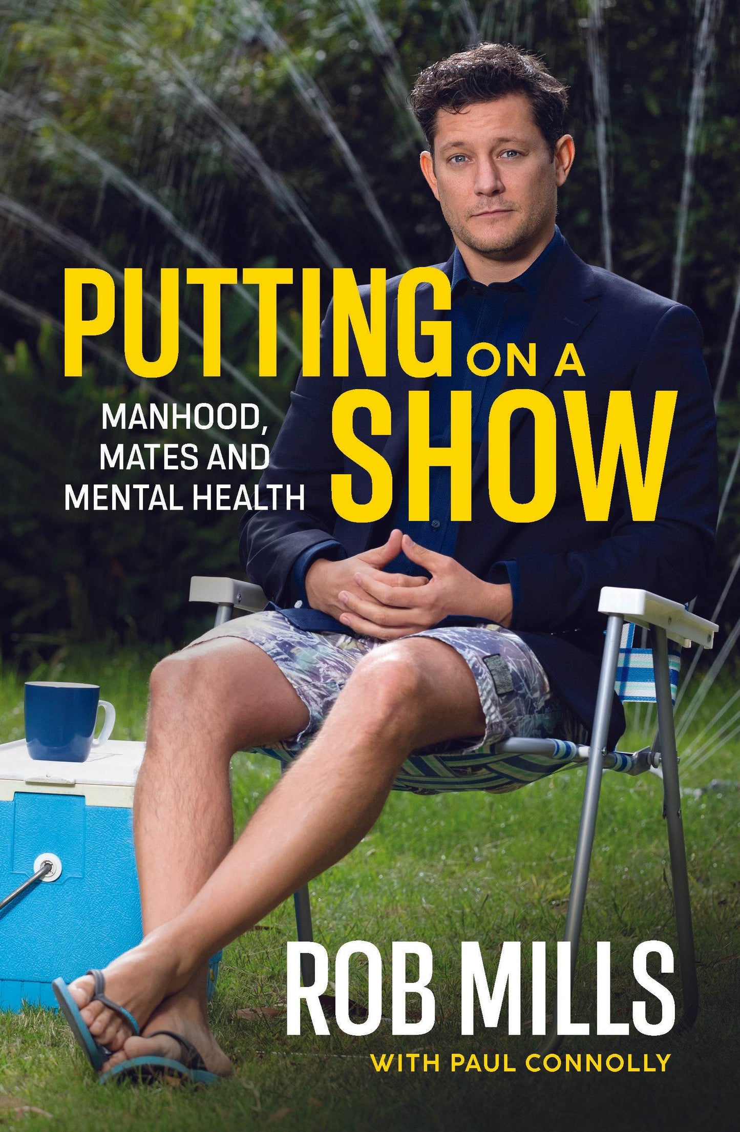Book cover of "Putting on a Show" by Rob Mills, exploring manhood and mental health.