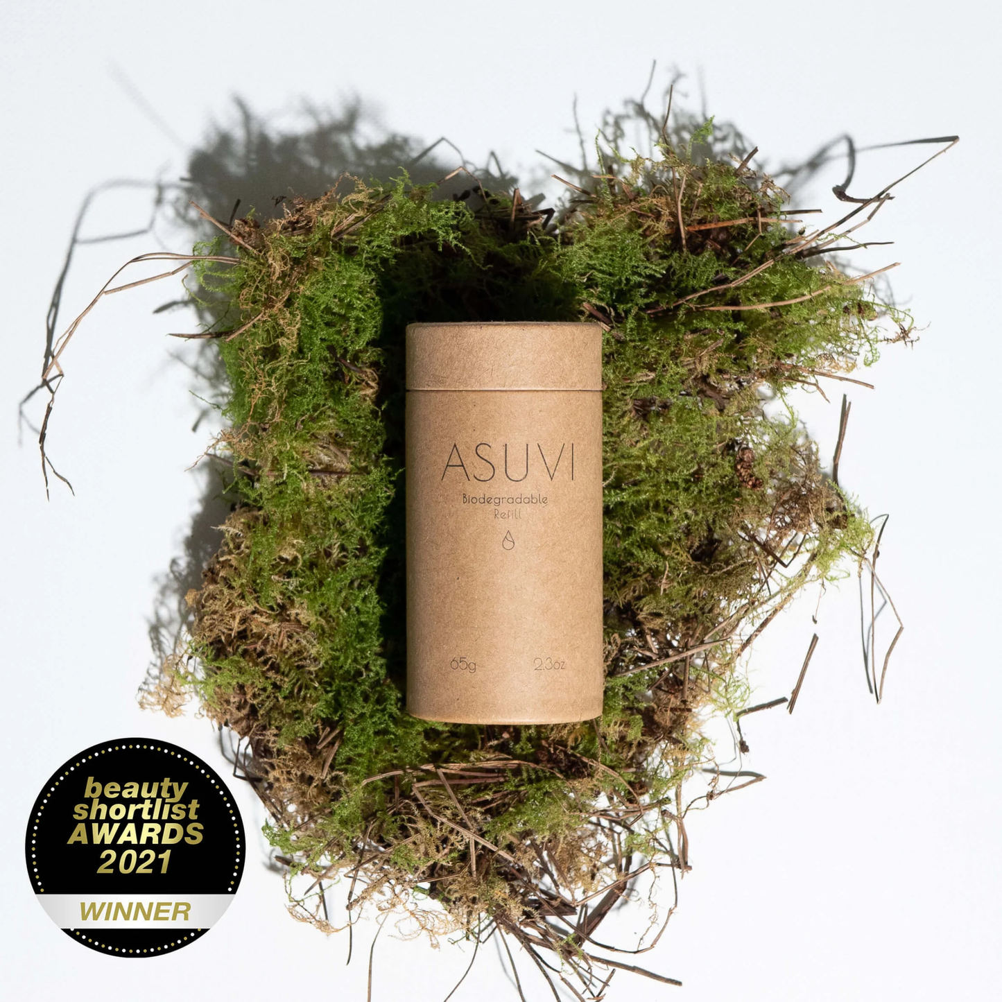 Asuvi Deodorant in eco-friendly packaging surrounded by natural elements, with Beauty Shortlist Awards 2021 Winner badge.
