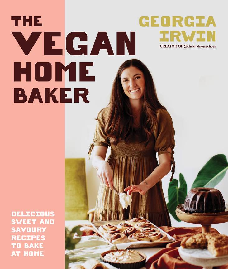 The Vegan Home Baker book cover showing Georgia Irwin with baked vegan pastries and cakes.