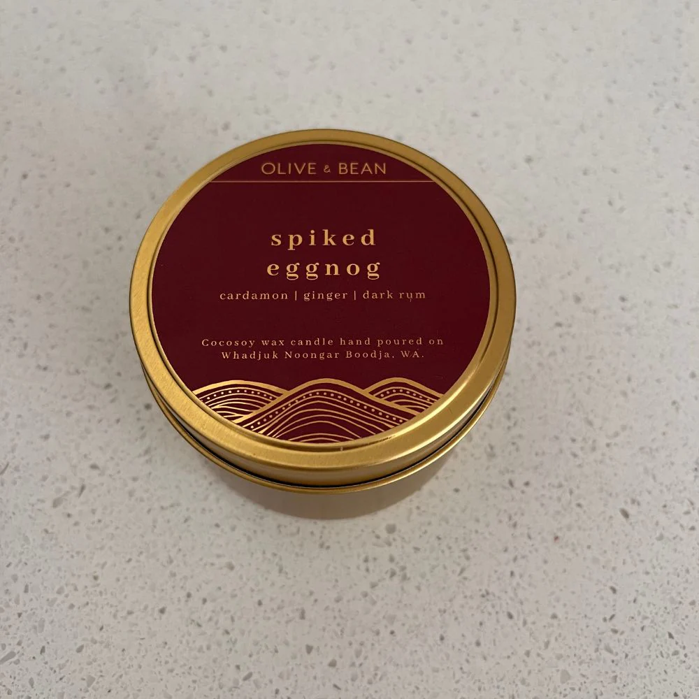 Olive & Bean Spiked Eggnog Christmas candle with cardamom, ginger, dark rum scent in gold tin container