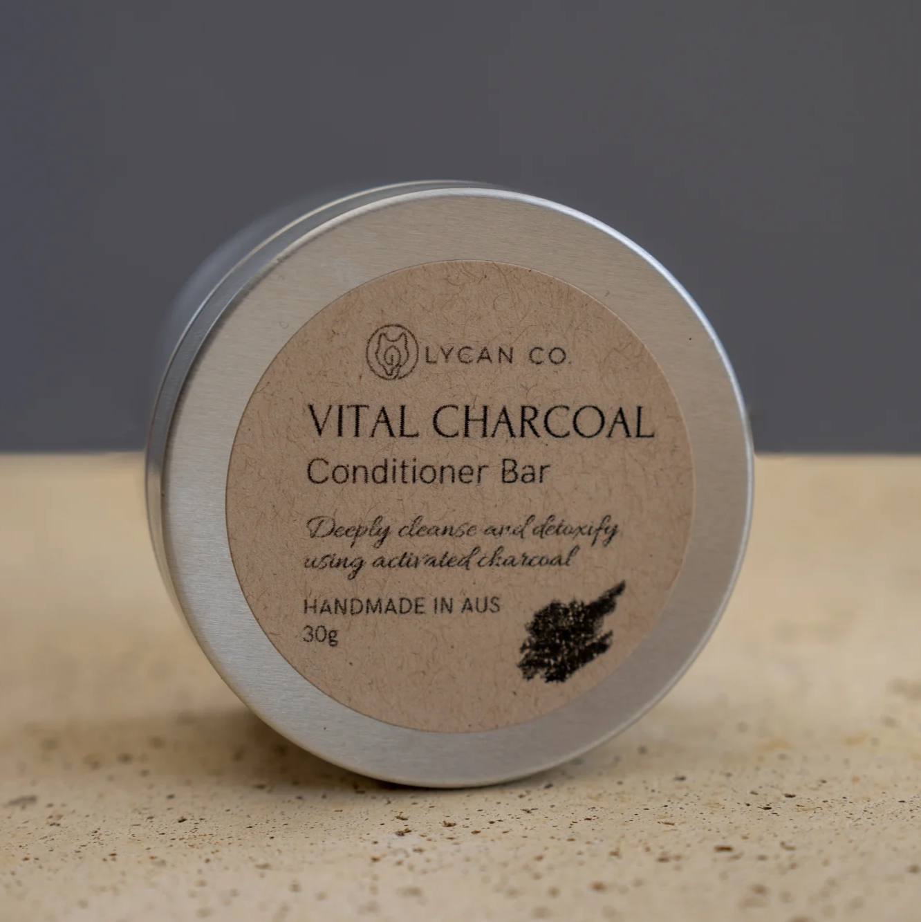 Vital Charcoal Conditioner Bar in tin packaging for deep cleansing hair care.