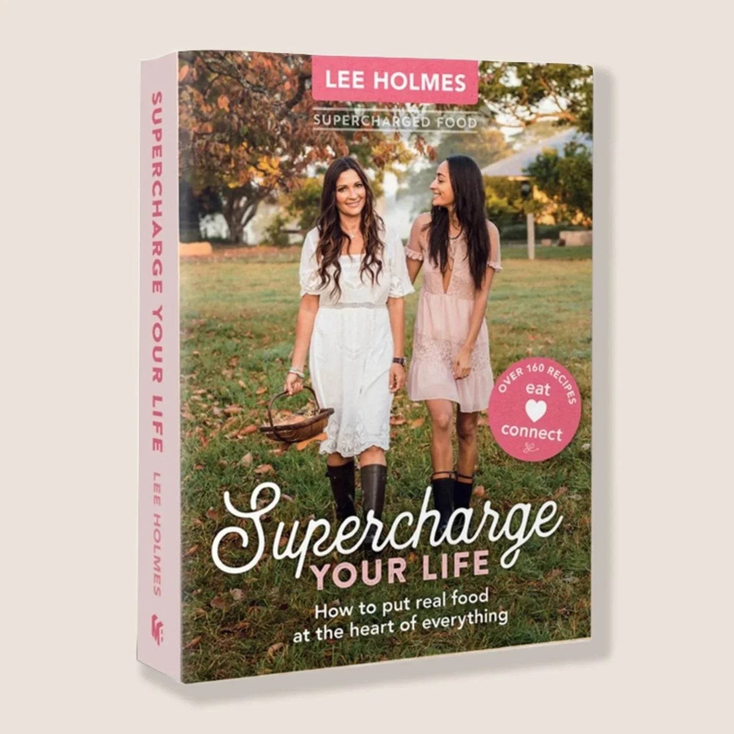 Book - Supercharge Your Life cover featuring two women in nature, emphasizing healthy recipes and Ayurvedic principles.