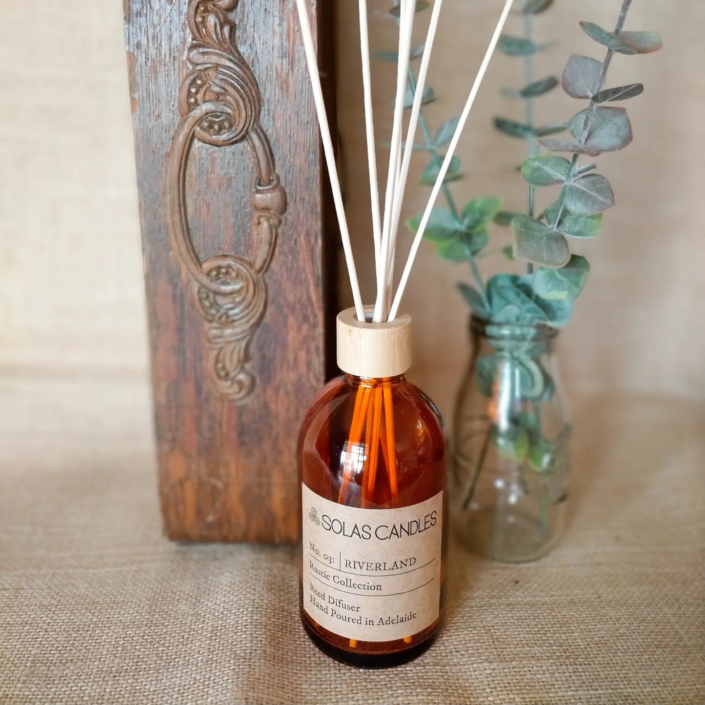 Solas Candles Rustic Collection No.03 Riverland with diffuser and natural decor.