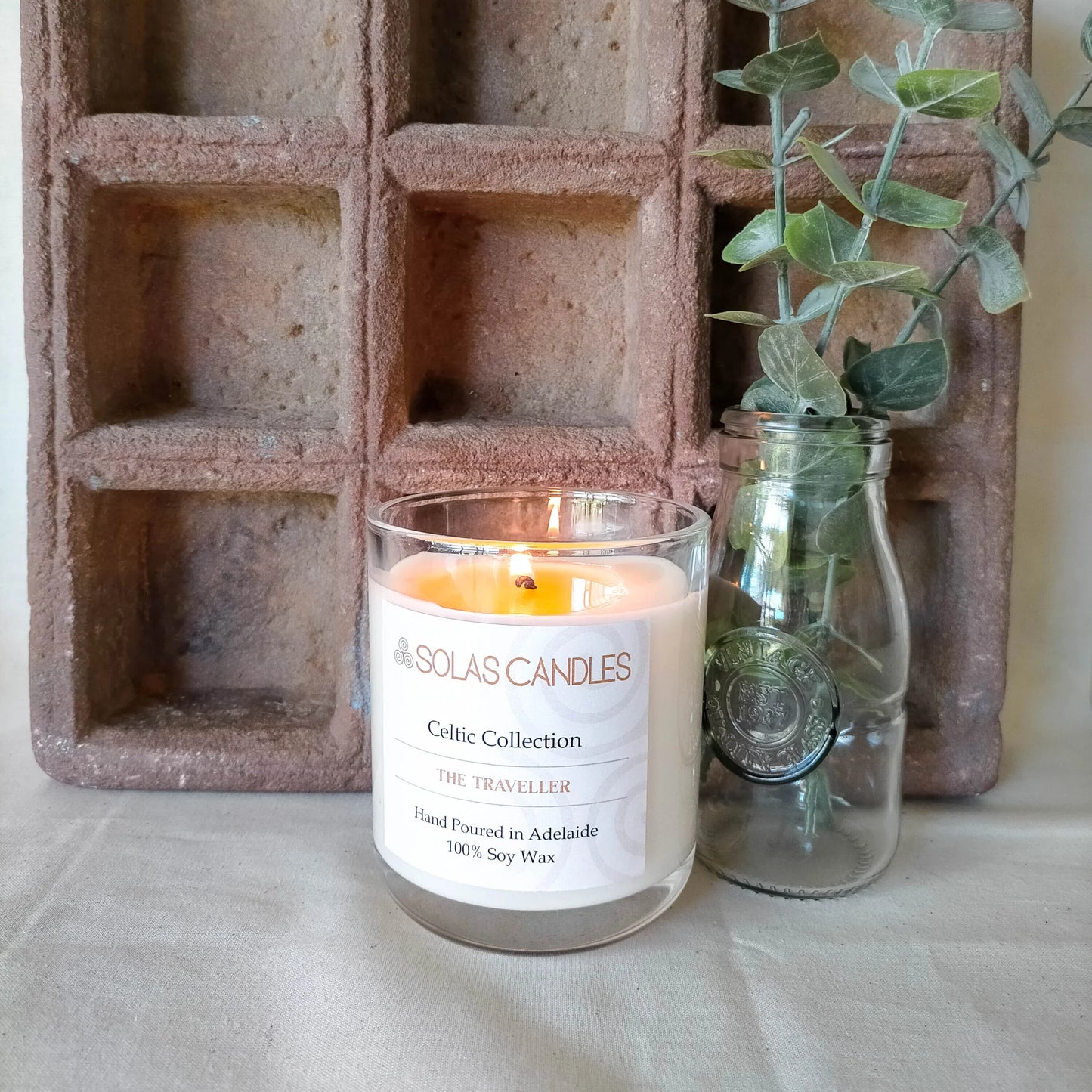 Solas Candles - Celtic Collection, The Traveller candle with rosemary, lemon, neroli, teak, and cedar leaf scent in a glass jar.