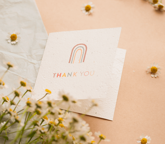 Plantable Thank You Card with Swan River Daisies, made from 100% recycled materials, shown with envelope.