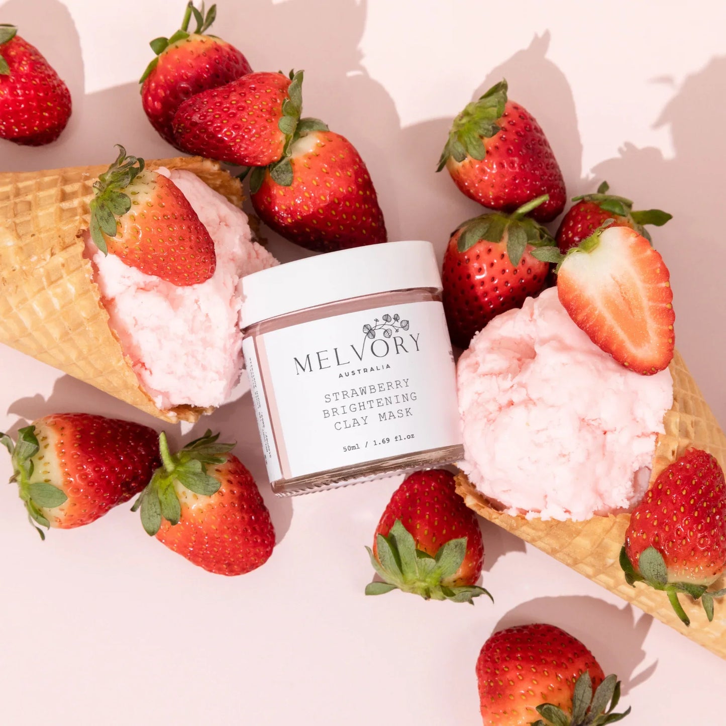 Melvory Strawberry Sundae Brightening Clay Mask bundle with strawberries and ice cream cones.