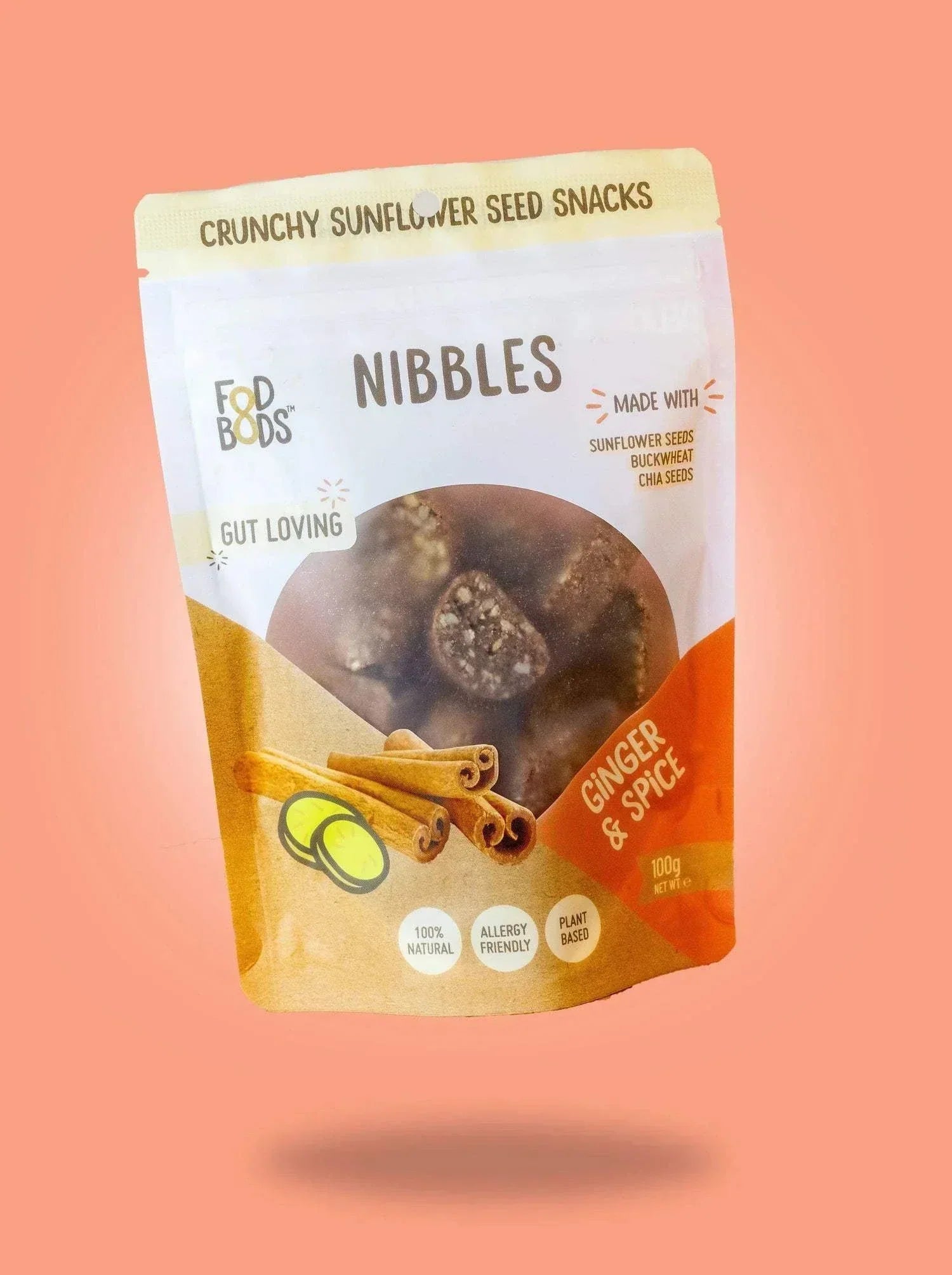 Fodbods Ginger and Spice Nibbles packaging on an orange background.