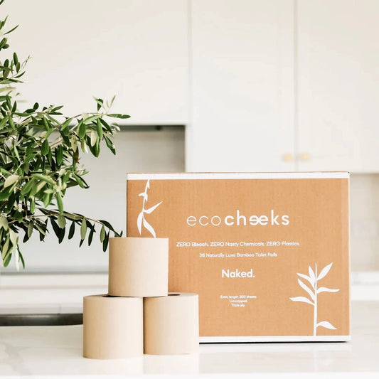 Eco-friendly bamboo toilet paper with sustainable packaging on display in a kitchen setting.