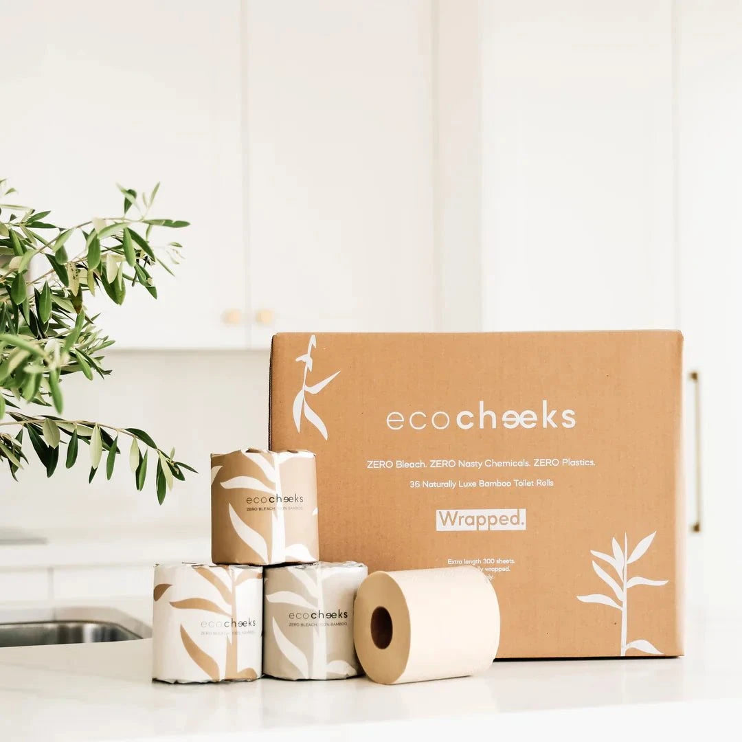 Eco-friendly bamboo toilet paper with decorative wrapping, featuring Eco Cheeks packaging.