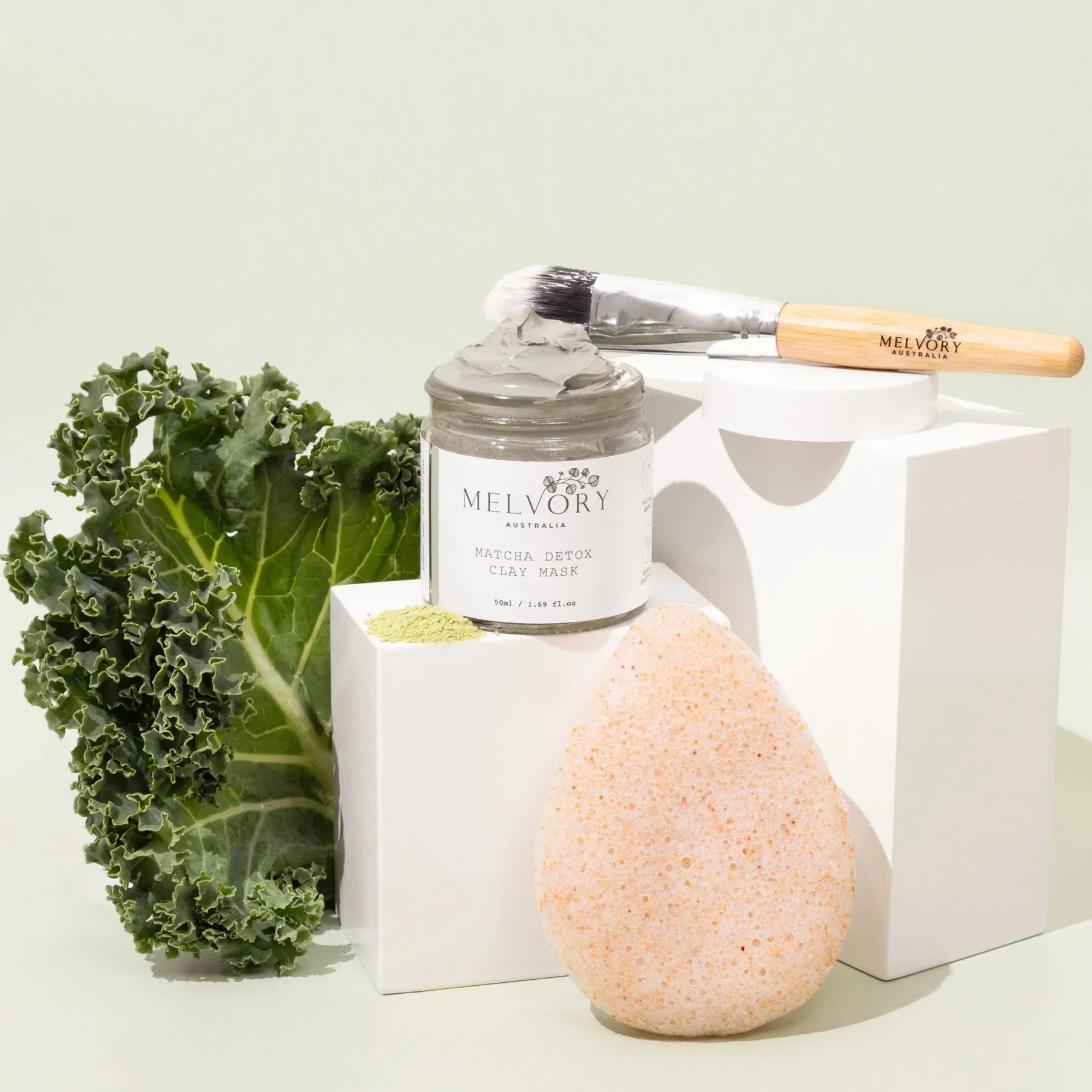 Melvory Matcha Sorbet Detox Clay Mask with bamboo brush and walnut konjac sponge, featuring antioxidant-rich green tea and kale for deep cleansing.