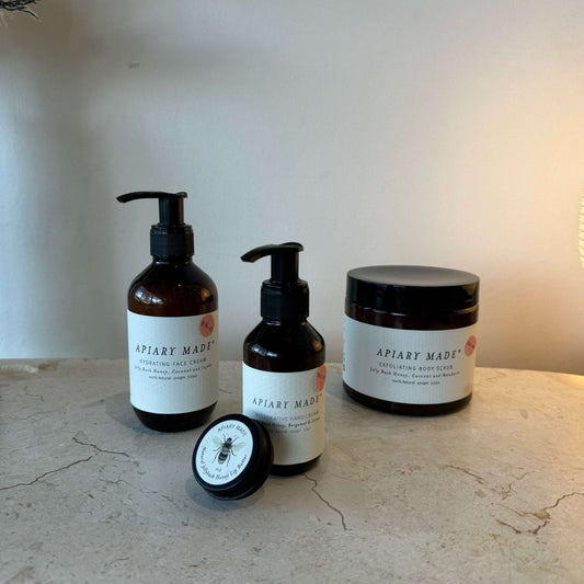 Apiary Made Bundle with exfoliating scrub, hydrating face cream, restorative hand cream, and nourishing lip balm.