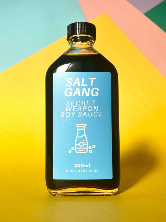 Salt Gang Secret Weapon Soy Sauce in 200ml glass jar, aromatic with 14 spices, ideal for stir fry or dressing.