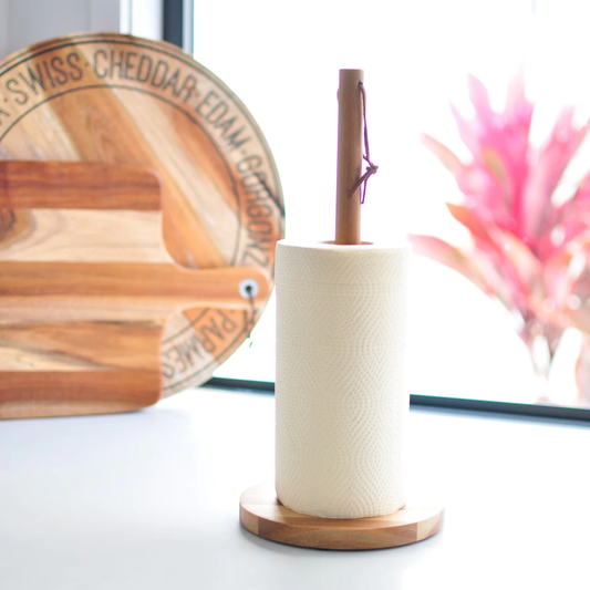 Eco Cheeks bamboo paper towels on a wooden holder, eco-friendly and biodegradable.