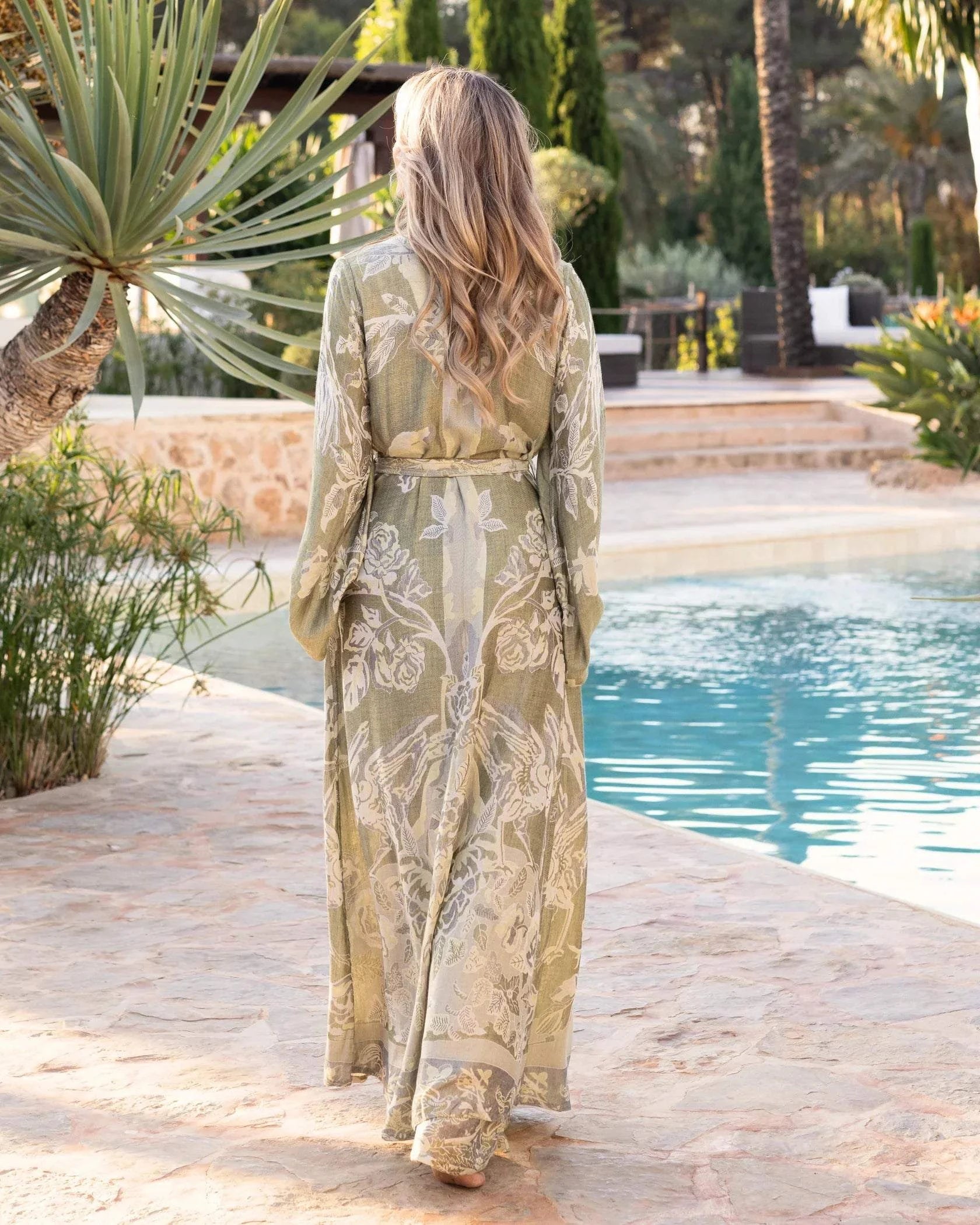 Brahmaki Eco-Friendly Maxi Kaftan in sage by poolside.